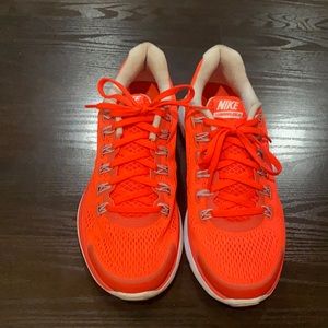 Nike Woman’s sneaker. Neon Orange and Gray